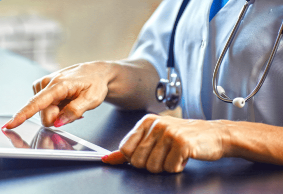 medical professional on tablet